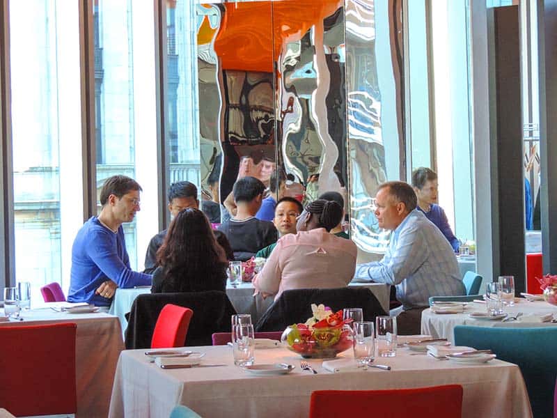 people at a table in one of the best restaurants in New York City museums