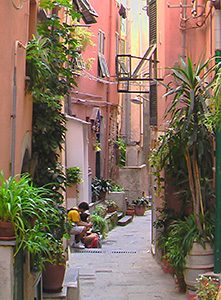 people on a narrow street in cinque terre