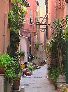 people on a narrow street 