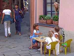 girls having a tea party outside their house