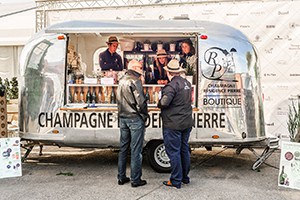 a trailer turned into a champagne bar for food festivals in Europe