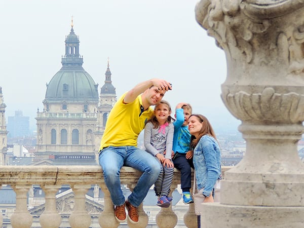 a family taking a selfie - family travel