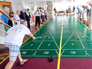 people playing shuffleboard on a Pacific cruise