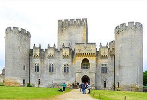 people walking to a castle