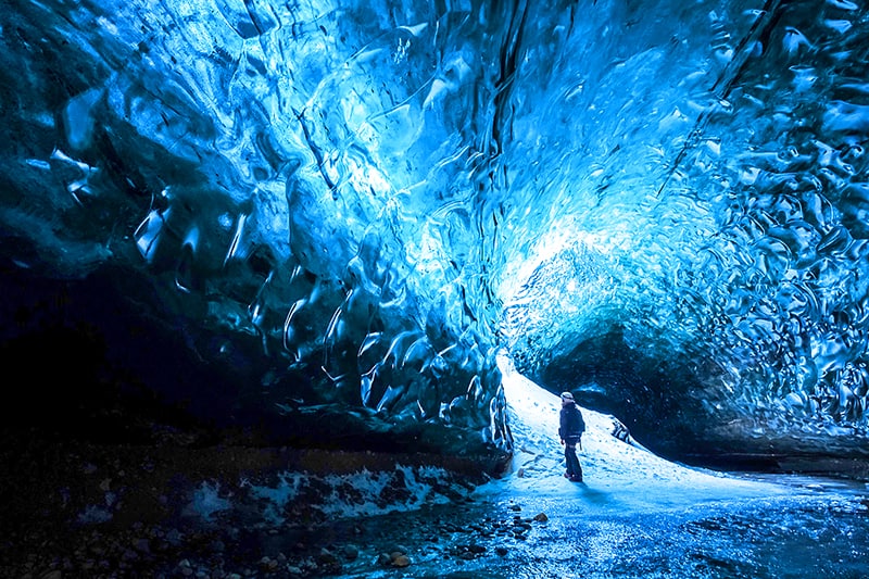 a man inside one of the Iceland ice caves