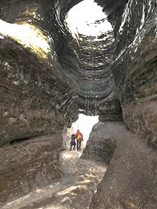 people walking in a cave - Iceland ice caves