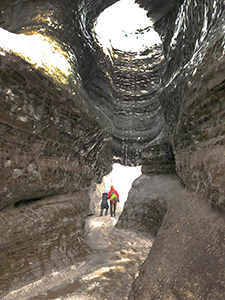 people walking in an the Iceland ice caves