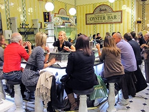 people at a restaurant having healthy food while traveling