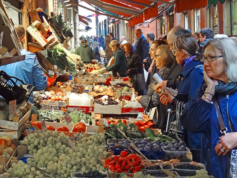 women in a vegetable market in Bologna
