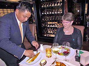 waiter deboning fish Silversea Muse