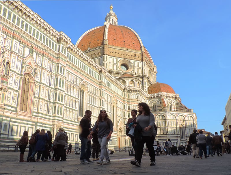 people walking past the Duomo in Florence, one of the best places to visit in Italy