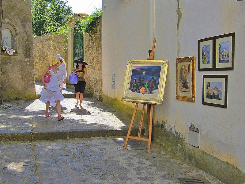 paintings hangin on a wall in Ravello, one of the best places to visit in Italy