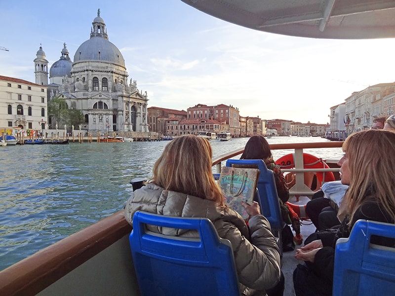 passengers aboard a vaporetto in Venice, , one of the best places to visit in Italy