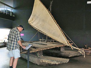 A man looking at a museum exhibit 