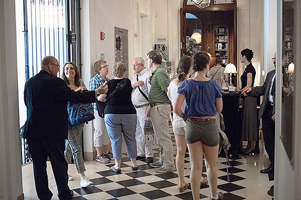 people in a foyer of a Museum