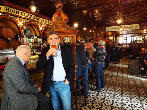 people drinking in an old saloon