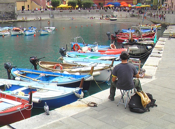 an atist painting boats