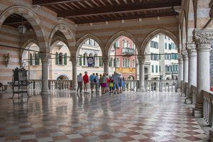 people looking at an old building in Fruili