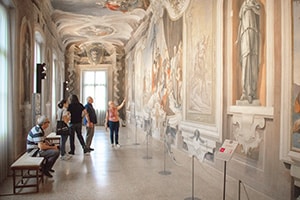 people looking at frescos in Friuli Venezia Giulia