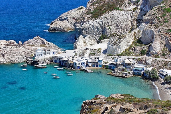 a quiet bay with boats on one of the best Greek islands to visit