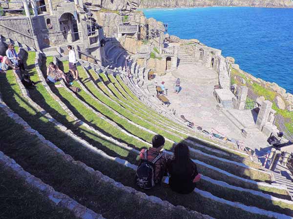 people in a greek theater in Cornwall