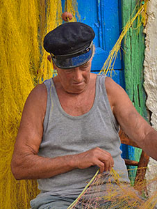 a fisherman tending his nets on Naxos