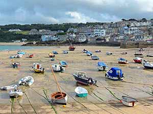 boats in a dry harbor in Cornwall