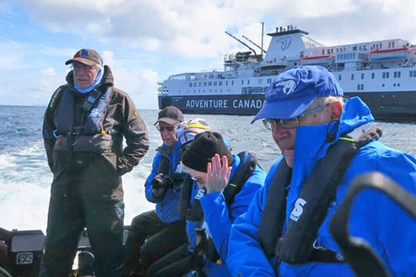 people in a zodiac in the Scottish islands