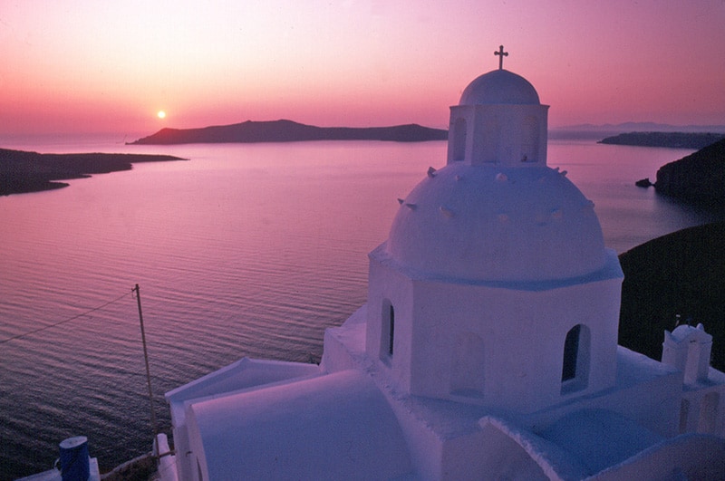 a church at sunset on one of the top Greek islands