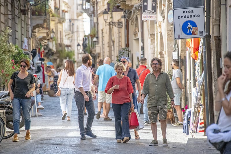 shoppers on a street - tour of sicily