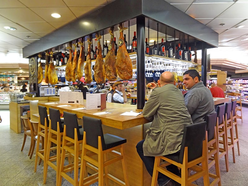 men seated a food bar