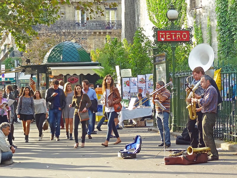 musicians on a busy sidewalk - seen on a walking tour of Paris