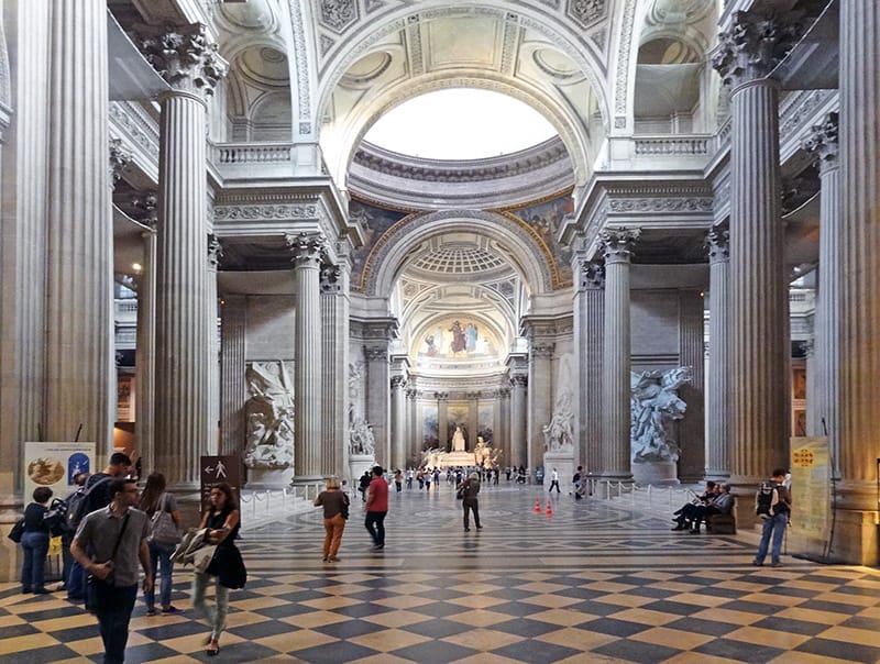 people walking through an ornate building - paris map