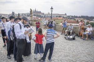 man looking at a map of Prague