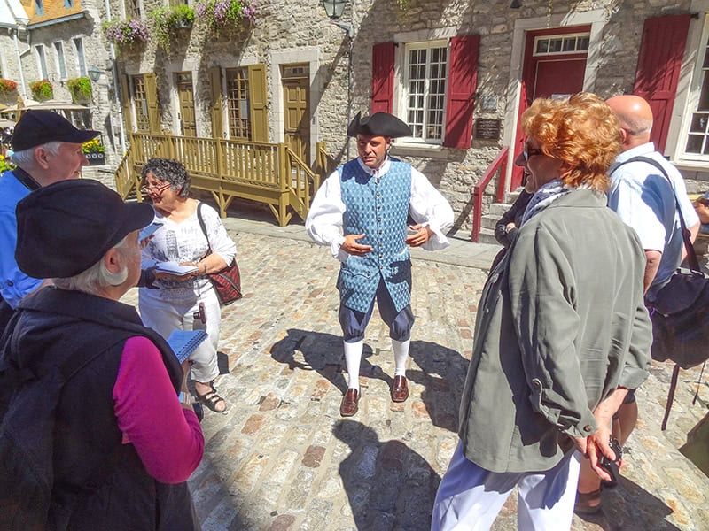 a tour guide in period costume seen on a tour of Quebec City