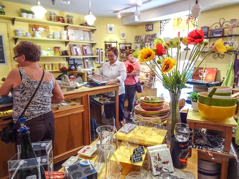 3 women in a gift shop seen on a tour of Quebec City