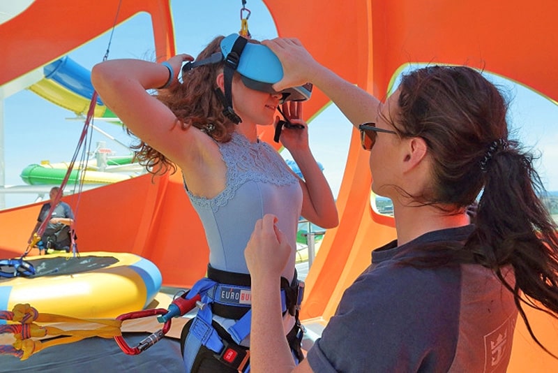 woman puting on a virtual reality mask on a mini-crruise