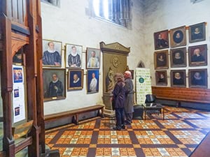 people looking at paintings