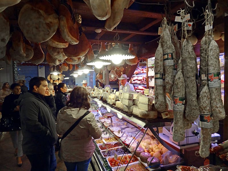 Shoppers standing by a food counter