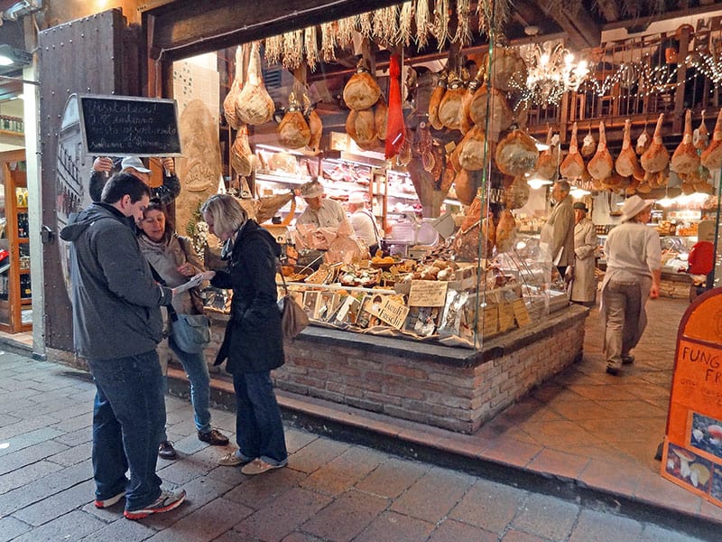 people by a store selling Bologna food in the Quadrilatero 