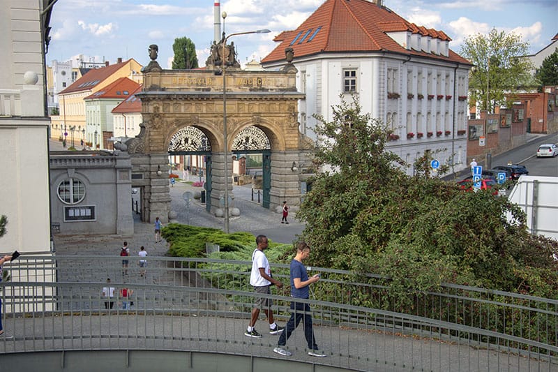 people in front of an old brewery
