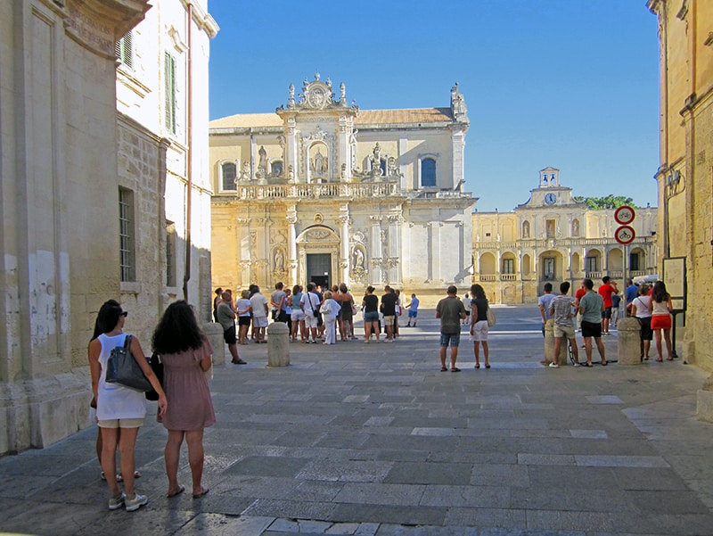 People viewing an old Baraque church in Lecce, Italy