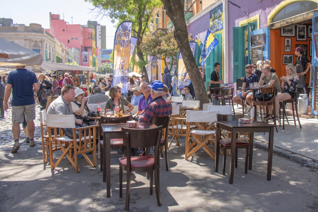 people in an outdoor cafe enjoying the weather,  one of the things to do in Buenos Aires