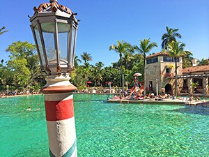 A pool with colorful Venetian styling, of the attractions in Miami