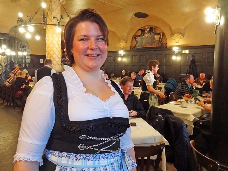 A waitress in a dirndl at a Munich beerhall