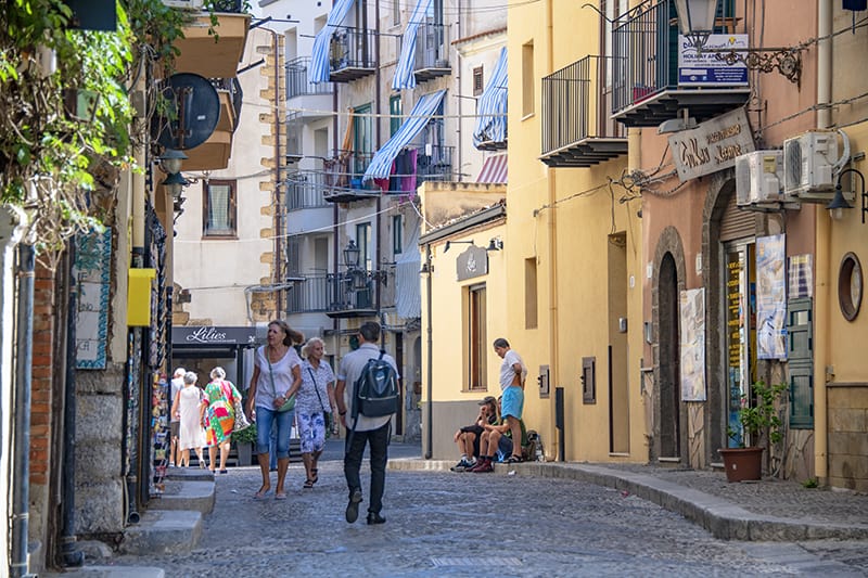 People walking along a street shopping