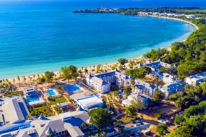 an aerial view of Negril, Jamaica and the Riu Palace Tropical Bay