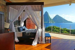 a hotel room open to the sea and mountains