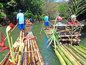 people satting on rafts on a river