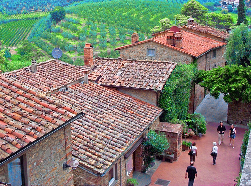 people walmking along an old street in Vinci, one of the hidden gems in Italy